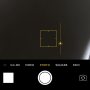 In the camera app on iOS you can select a light or dark spot and the camera will adjust. But if you swipe up or down you can manually make it darker or lighter.